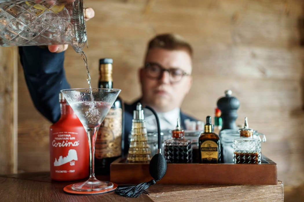 Bartender making a cocktail at Casa Guargnè bar