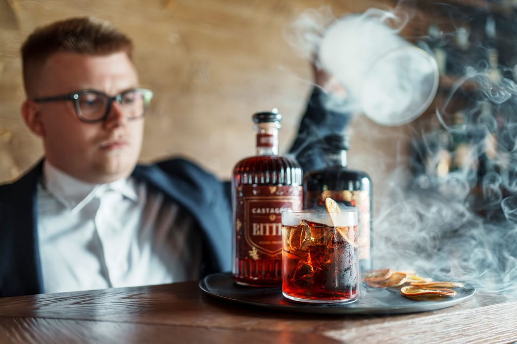 Bartender making a cocktail at Casa Guargnè bar